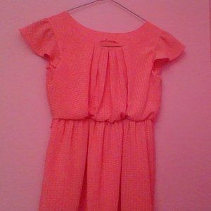 Peach ruffled dress.